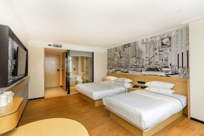 A hotel room with two beds, a television, a desk, and a mural on the wall. - City Comfort Inn (Dongxing Port) (Dongxing)