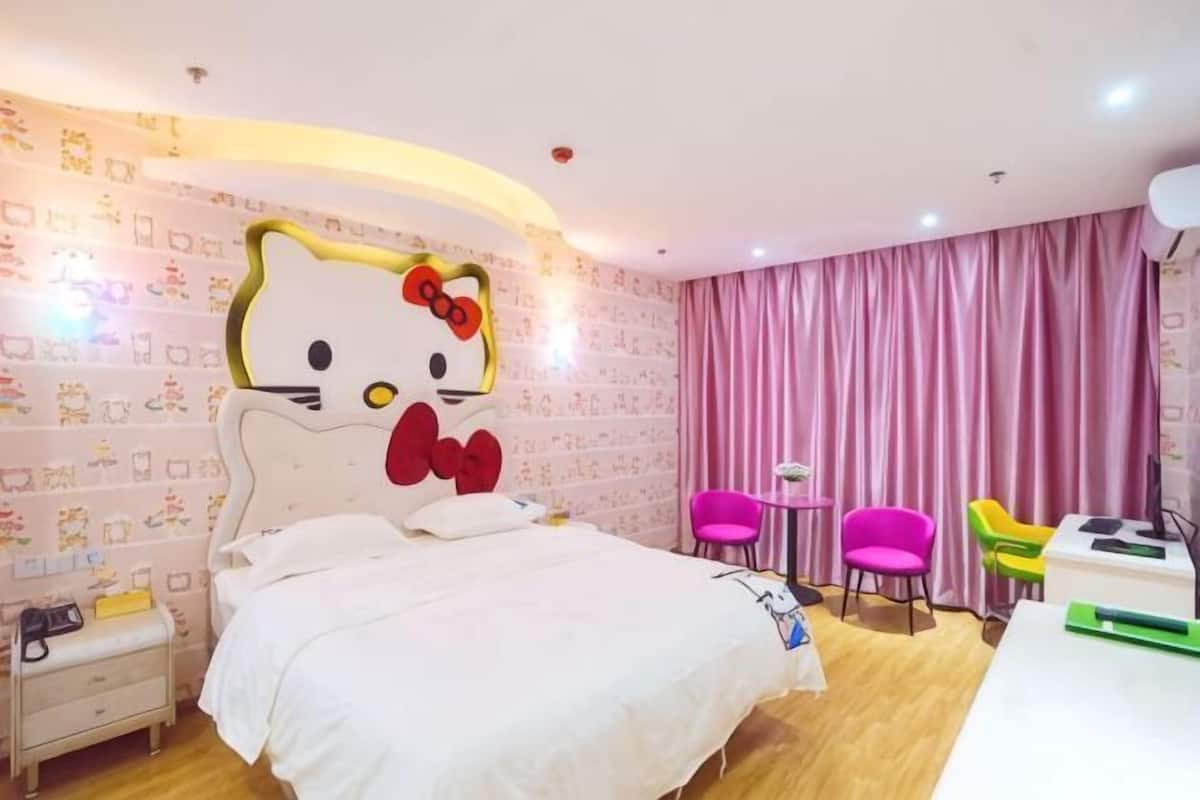 A room with a bed, a desk, and a chair.