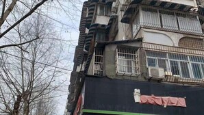 A multi-story building with balconies and barred windows. - Xiyuan Accommodation (Wuhan Union Hospital Zhongshan Park Branch) (Wuhan)