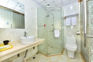 A bathroom with a glass-enclosed shower, a white sink, and a toilet. - NANYUAN INN (Cixi Sanbei East Road) (Cixi)