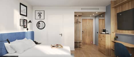 A modern bedroom with a bed, bedside table, and wall art.