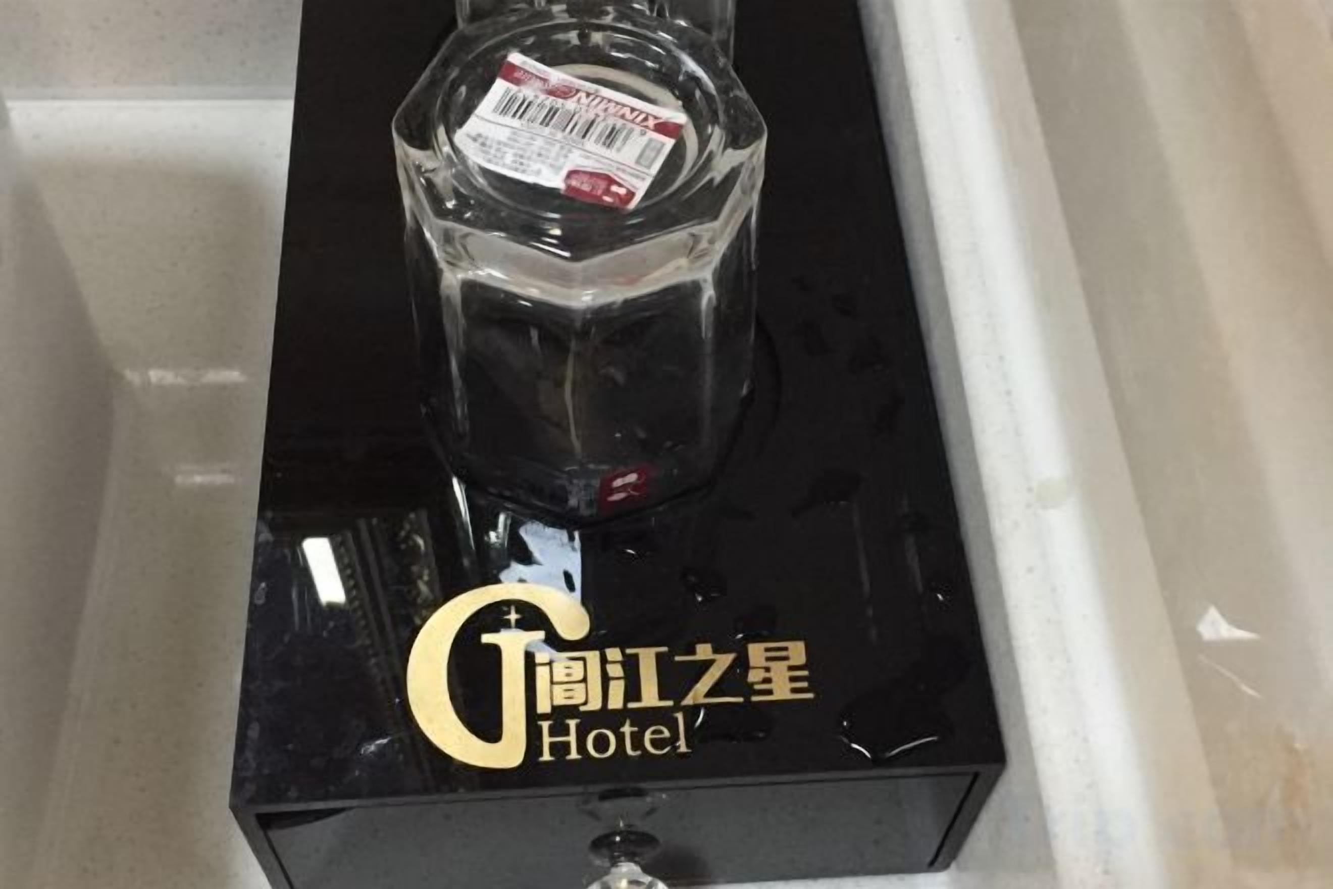 A black box with a clear bottle on top and the text 'Gongjiang Star Hotel' on it.