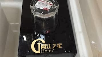 A black box with a clear bottle on top and the text 'Gongjiang Star Hotel' on it.