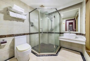 A bathroom with a glass-enclosed shower, a toilet, a sink, and a towel rack. - Fuzhicheng Boutique Hotel (Yuantan Railway Station Branch) (Qingyuan)