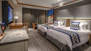 A hotel room with two beds, a desk, a TV, and a large window with curtains. - PULUN HoTEL (Cixi Wuyue Plaza) (Cixi)