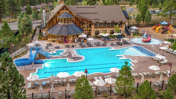 A resort with a large pool, outdoor seating, and a lodge with a ski lift. - The Cottages at Old Greenwood (Truckee)