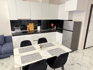 Family Apartment, 2 Bedrooms | Private kitchen | Fridge, stovetop, coffee/tea maker, toaster