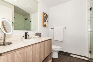 Luxury Condo | Bathroom | Shower, hair dryer, towels, soap