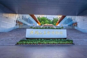A staircase leading to a building entrance with a sign in front.