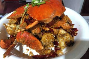 A seafood dish with a crab on a white plate. - China Manor Hotel & Restaurant (Colombo)