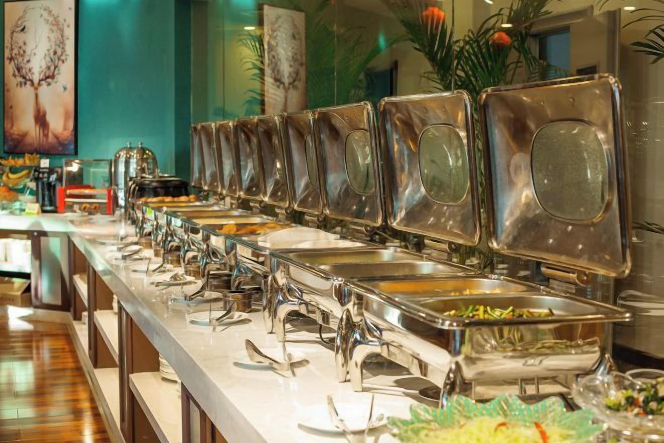 A buffet setup with multiple serving stations.