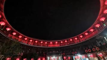 A circular structure with a central open area, possibly a courtyard or plaza, surrounded by walls with evenly spaced openings.