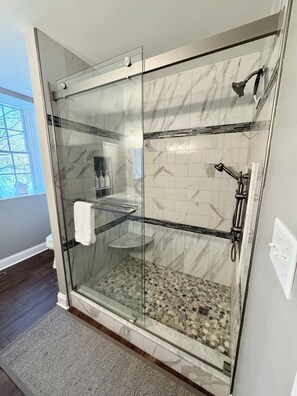 Shower, hair dryer, towels, soap