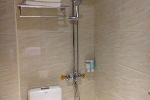A bathroom with a shower, a towel rack, and a toilet. - Tanghe Inn, Yucheng (Rucheng)