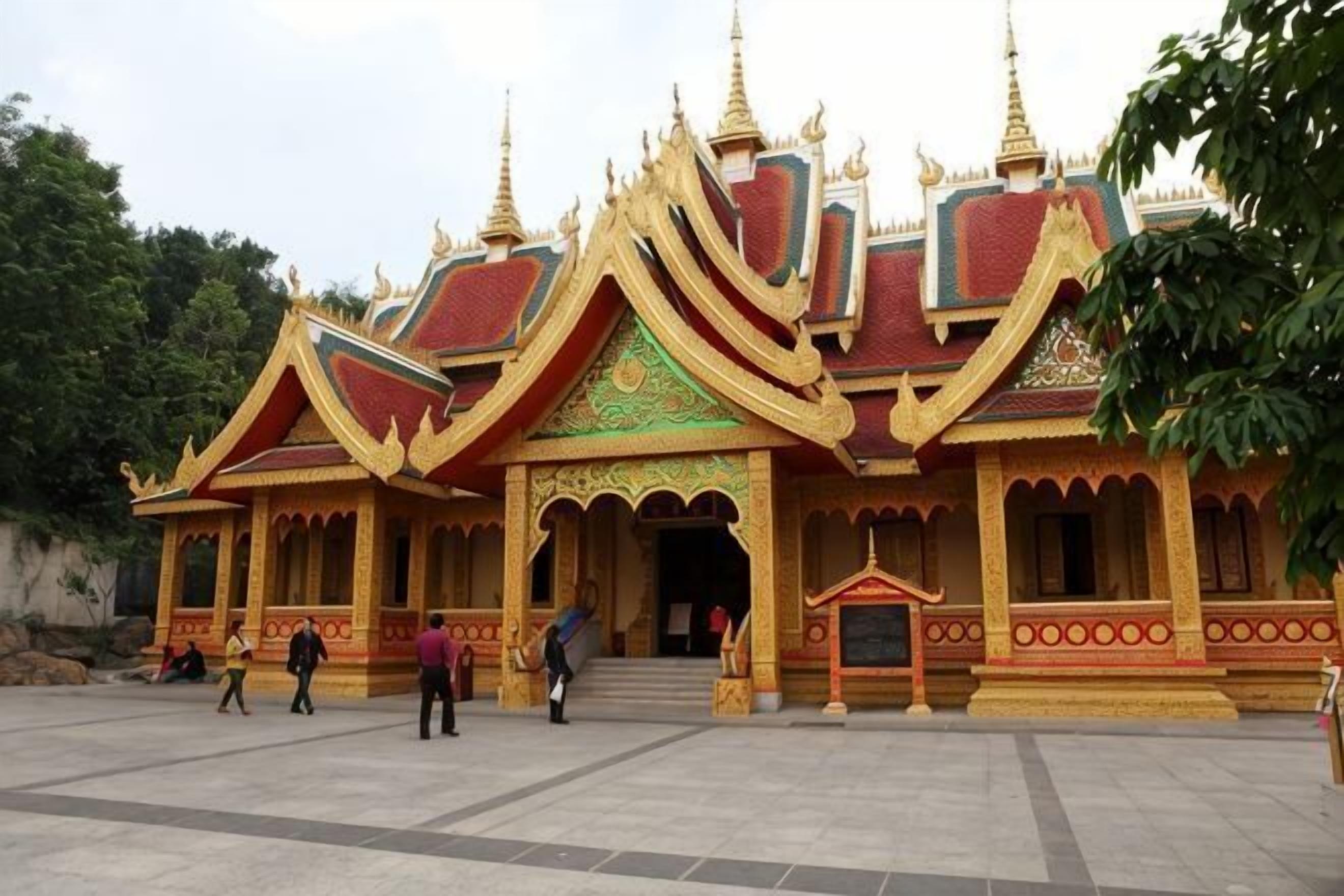 A traditional temple with a multi-tiered roof, ornate decorations, and a central entrance.