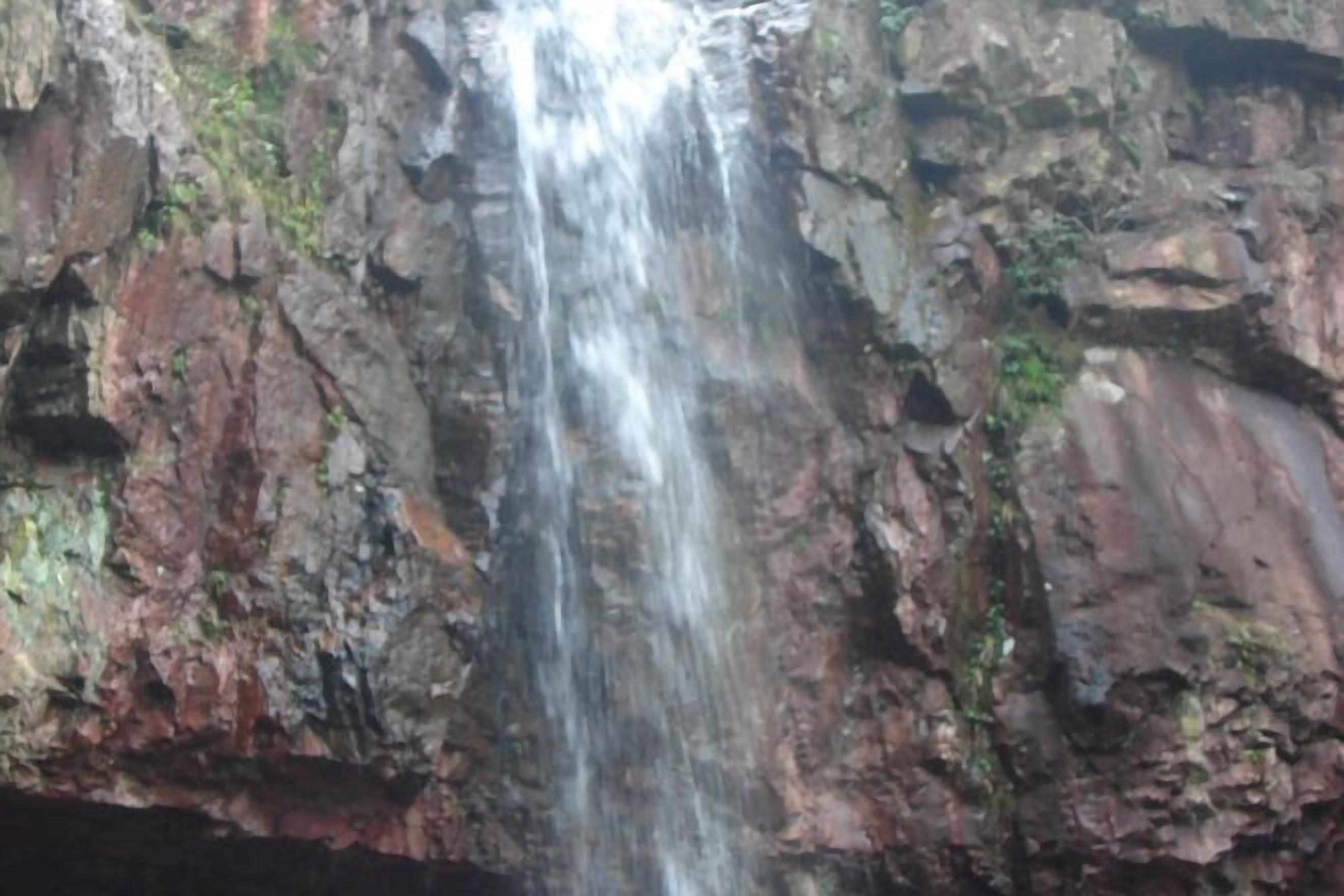 A waterfall cascading down a rocky cliff.