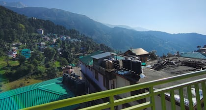Golden View BnB Mcleodganj
Room with private balcony facing mountain view.