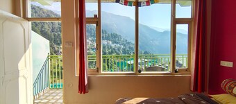 Golden View BnB Mcleodganj
Room with private balcony facing mountain view.