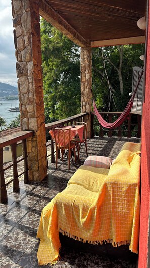 Family Room, Sea View | Living area | 32-inch Smart TV with digital channels