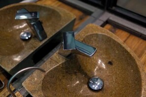 Two granite sinks with chrome faucets in a public restroom. - Wuxi Dayin Mountain Residence Garden Homestay (Wuxi)