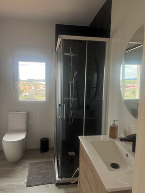 Shower, hair dryer, towels, soap