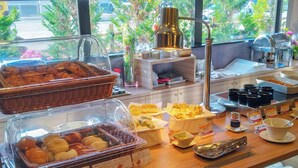 A breakfast buffet with various food items and condiments. - Hotel Route Inn Grand Chichibu (Chichibu)