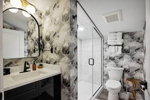 Shower, hair dryer, towels