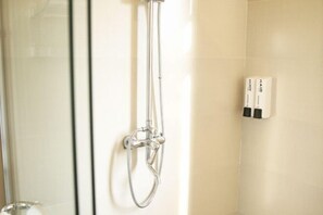 A shower with a handheld hose and a wall-mounted control panel. - Vanpo · City Boutique Business Travel Hotel (Zhongshan)