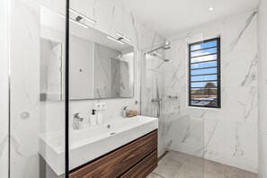 Shower, hair dryer, towels, soap