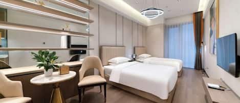 A modern hotel room with a bed, bedside tables, a desk, and a chair.