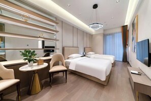 A modern hotel room with a bed, bedside tables, a desk, and a chair. - Humgait Hotel (Hangzhou)