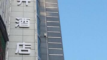A building with a sign that reads "Hotel" in large, white letters.