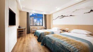 A hotel room with two beds, a desk, and a large window with a city view. - Xinhua Hotel Nanchuan (Chongqing)