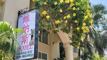 A hotel sign with contact information.