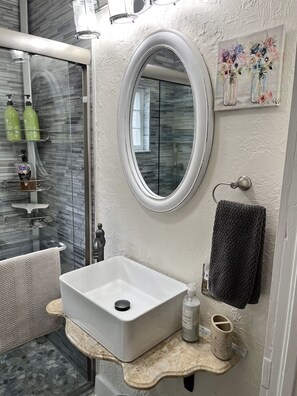 Shower, hair dryer, towels, soap