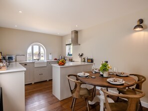 Dining - A beautifully curated cottage sleeping four with two sleek bathrooms. (Great Ryburgh, near Fakenham)