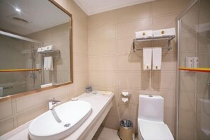 A bathroom with a sink, mirror, toilet, and towel rack. - Super 8 Hotel Zepu Fatong Park (Zepu)