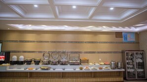 A buffet setup with various food items and containers. - Super 8 Hotel Zepu Fatong Park (Zepu)