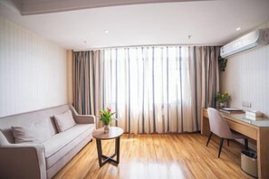 A modern hotel room with a wooden floor, a sofa, a desk, and a large window with curtains. - Super 8 Hotel Zepu Fatong Park (Zepu)