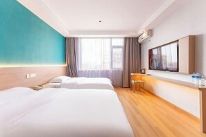 A hotel room with two beds, a desk, a chair, a TV, and a large window with curtains. - Bojin Hotel (Cixi Zhouxiang Bus Station) (Cixi)