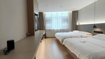 Desk, blackout drapes, iron/ironing board, bed sheets