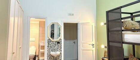 Deluxe Quadruple Room, City View | Bathroom | Rainfall showerhead, hair dryer, bathrobes