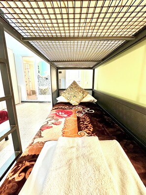 A room with a bed, a large window, and a view of the outside. - B&B Termini Colosseo Suite (Rome)