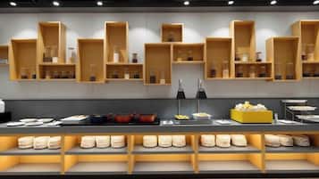 A modern kitchen with wooden shelves and a buffet setup.