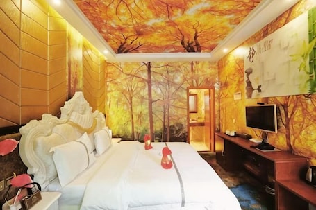 A hotel room with a large bed, a television, and a decorative ceiling mural.. Rahm Holiday Theme Hotel