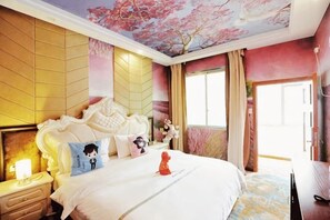 A bedroom with a large bed, a nightstand, a dresser, and a ceiling with a floral design. - Rahm Holiday Theme Hotel (Xiaojin)