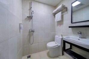 A small bathroom with a toilet, a sink, and a shower. - 99inn Selected (Beijing Huilongguan East Street Metro Station) (Beijing)