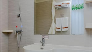 A bathroom with a shower, sink, and a large mirror. - Thank You Inn Beijing Huairou Yanqi (Huairou)