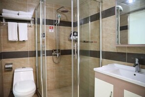 A modern bathroom with a glass-enclosed shower, a white toilet, and a sink with a mirror above it. - NANYUAN INN Hotel (Lishui High-speed Railway Station) (Lishui)