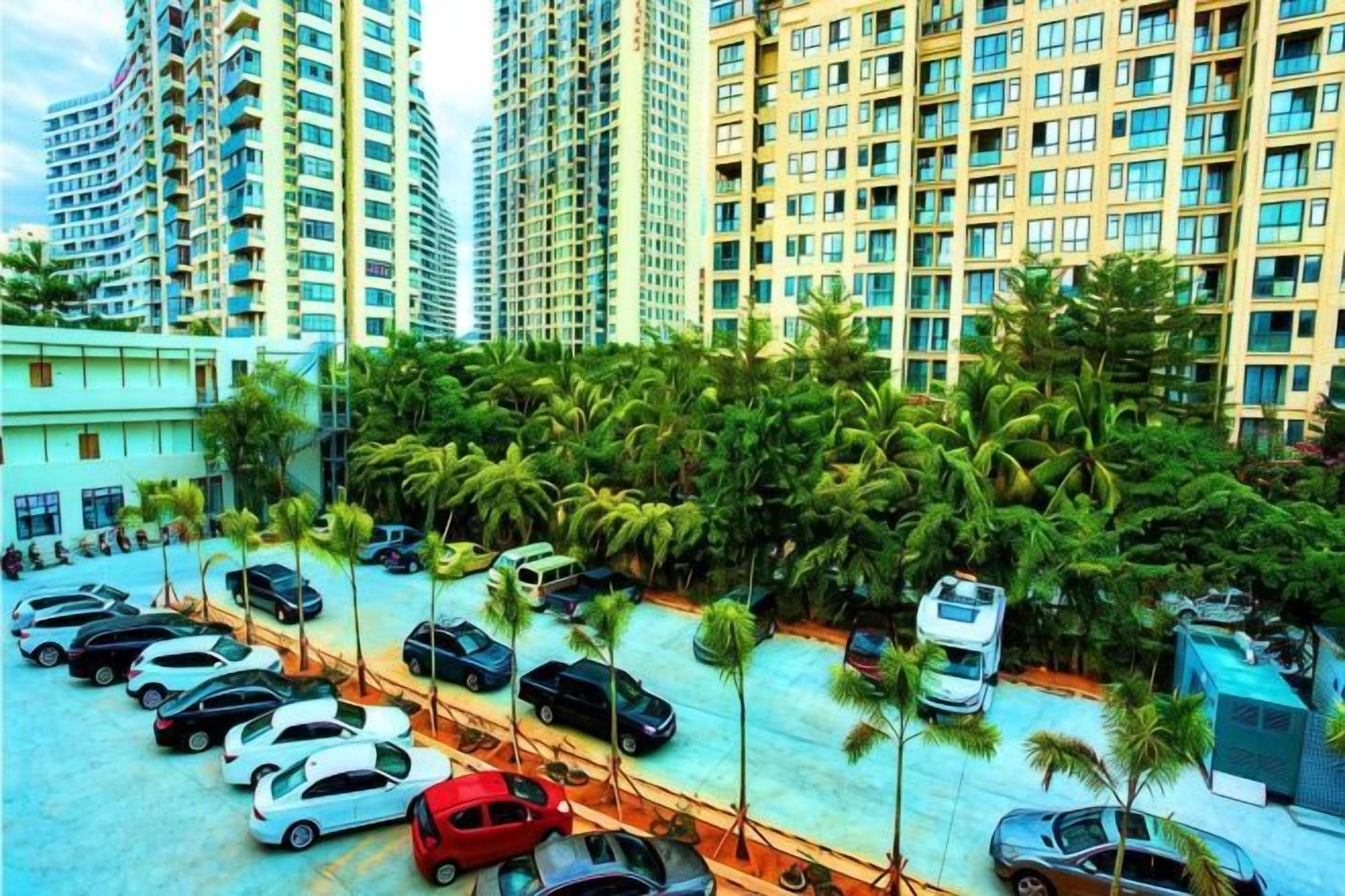 A parking area with multiple cars, surrounded by tall residential buildings and palm trees.